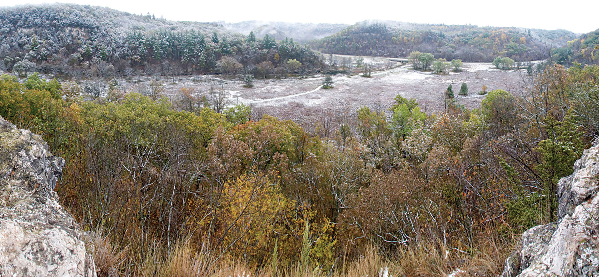Panorama of snow on fall colors